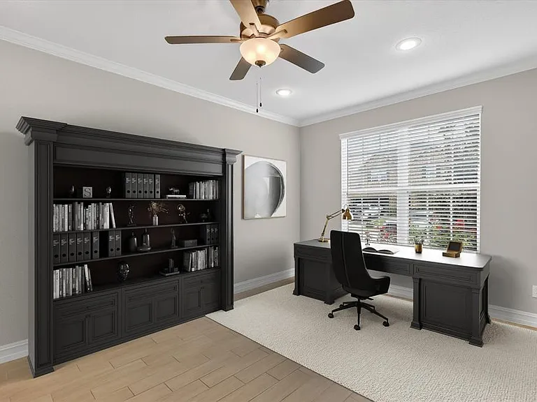 Dedicated workspace featuring a built-in bookcase, light wood-finish flooring, and a window with blinds