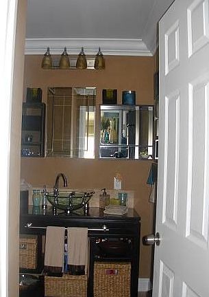 Ultra-contemporary Master Bath with glass vessel sink, custom cabinets .