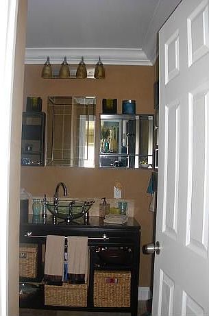 Ultra-contemporary Master Bath with glass vessel sink, custom cabinets .