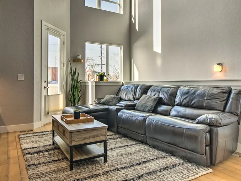 Living room w/ small balcony on the main level
