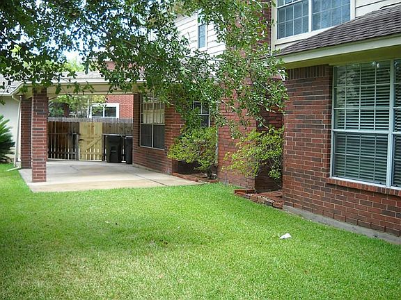 NICE FENCED YARD WITH LARGE COVERED PATIO