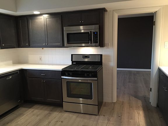 Kitchen with door opening to dining room