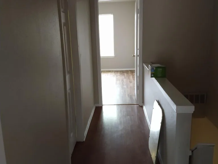 view of the front bedroom in the upstairs hallway