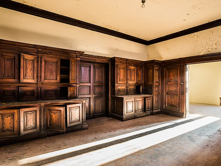 Before: Architectural accents like these wood-lined walls with historical value