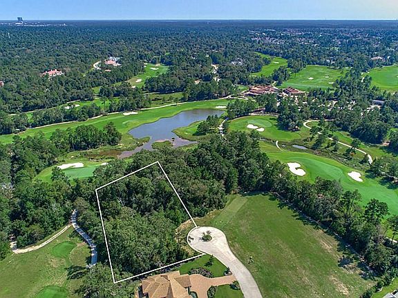 Expansive golf course views on two sides of the lot.