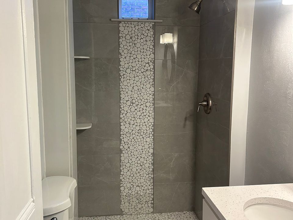 Custom tiled shower, solid wood vanity with quartz top