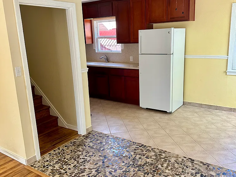 Dining area/upstairs entry.