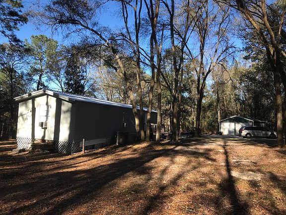 Rear View of the house and backyard