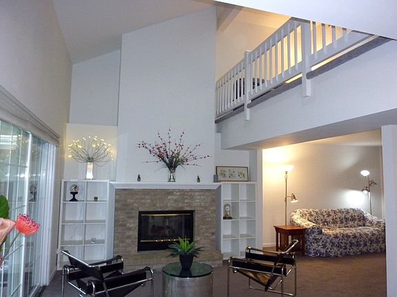 Gorgeous 2 story Family Room with brick fireplace, mantle and slider to screen porch