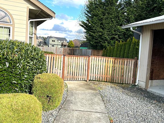 Private Walkway to Front Door and Fenced Yard