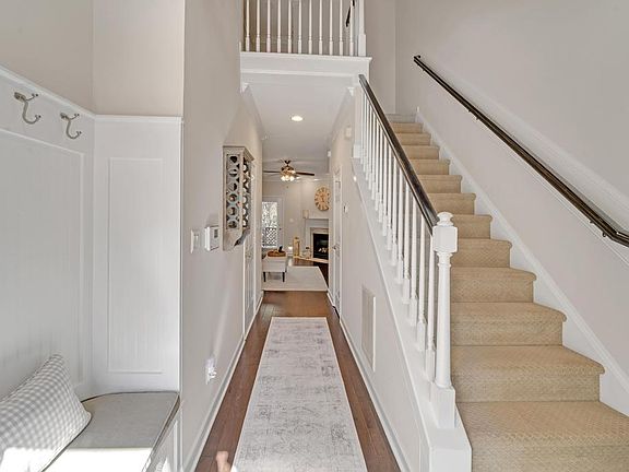 2 story entryway with bench