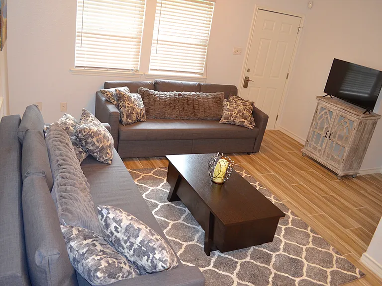 Guest house living room with 2 foldout couches.