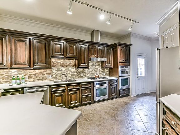 Another view of the modern kitchen with stainless steel appliances.