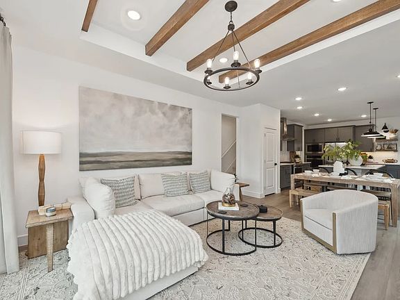 Great room with stained ceiling beams