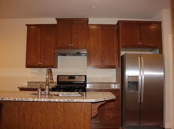 Kitchen with island located on first floor
