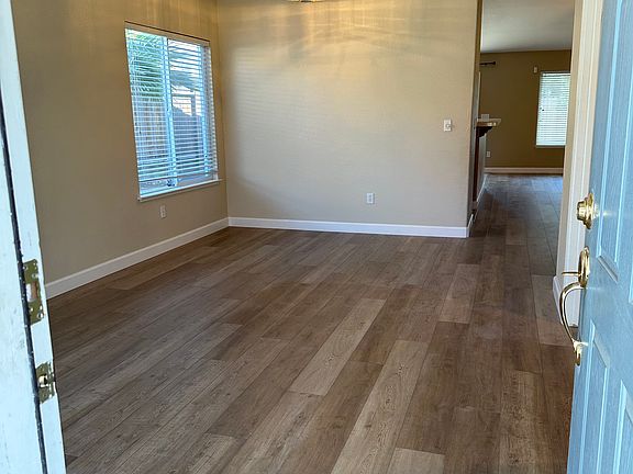 Entering front door into front living room and dining room