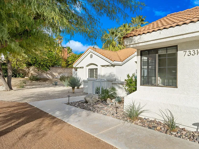 Walkway leading from garage to front doors.