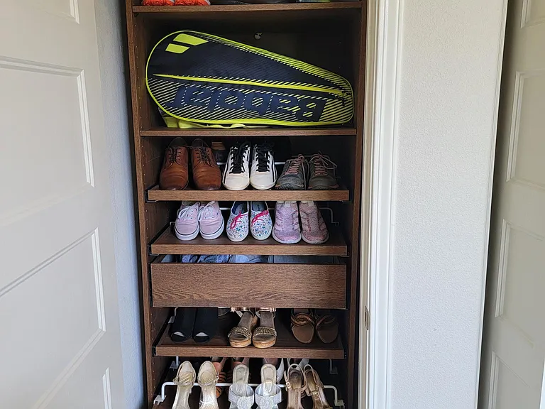 Furnished Shoe closet with plenty of room to store other stuff.