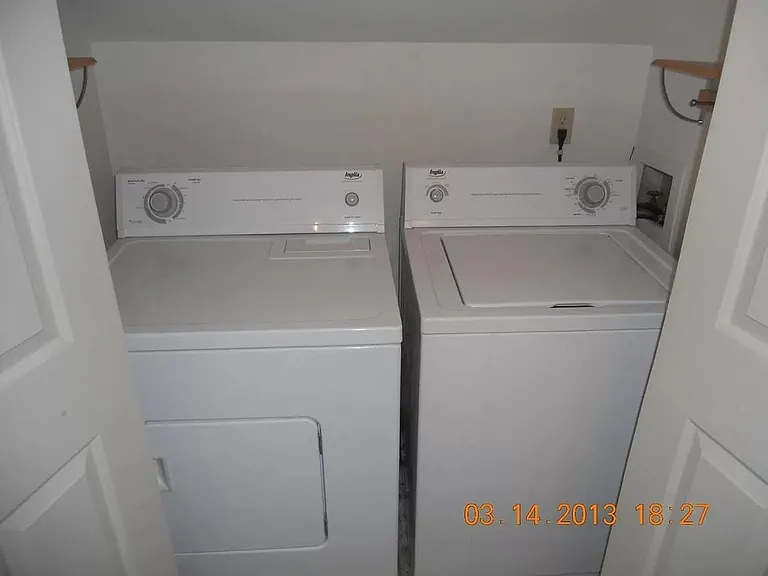master bedroom with full bath and laundry