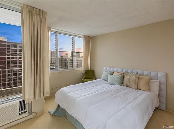 This is the master bedroom suite with mirrored closets and lots of windows.  The walls were just recently painted a neutral color.  Easily fits a king size bed and one or two dressers.