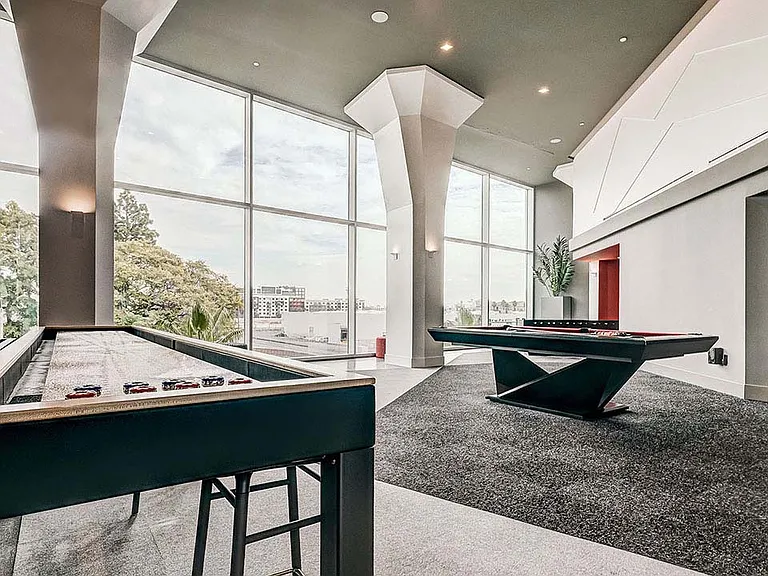 Griffis Platinum Triangle resident lounge with shuffleboard and billiards.