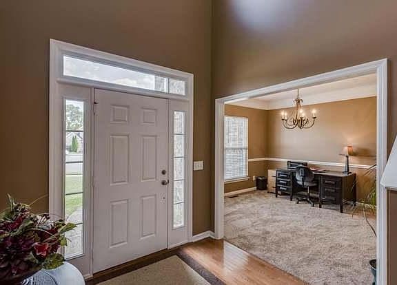 Front foyer looking back at the front door and Dining/Office Area