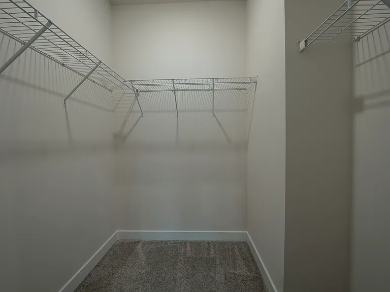 One of two walk-in closets in the Owner's bedroom (this is the "small" one)