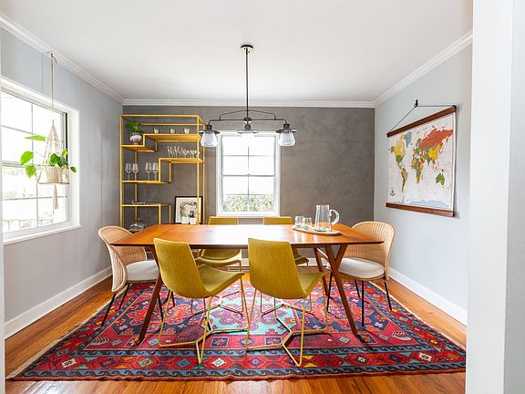 Antique rugs throughout the home and many spaces have custom plaster finishes.