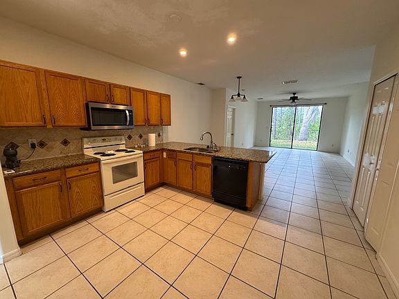 View from left to right: Kitchen, Breakfast Nook, Master Bedroom entry, Living Room and Pantry.