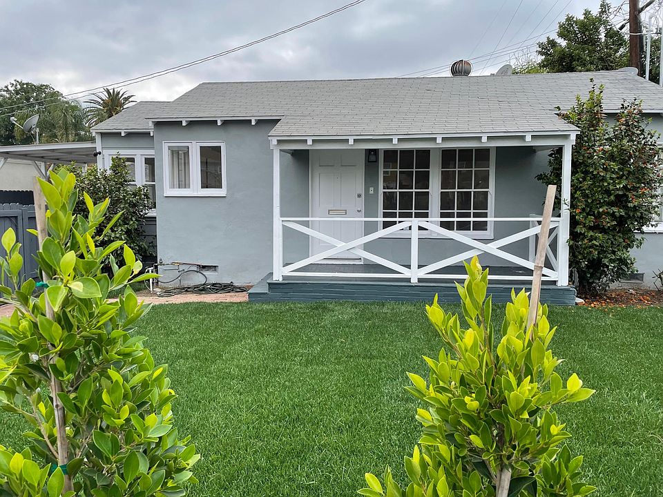 Front of house inside fenced yard
