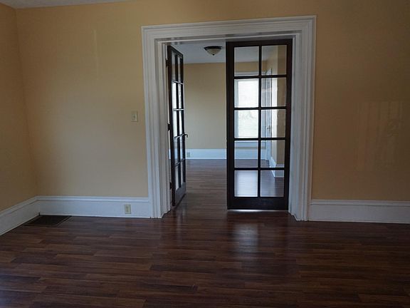 From living room looking into first floor bedroom