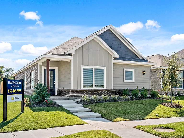 The Tulip has a beautiful siding exterior with brick accents.