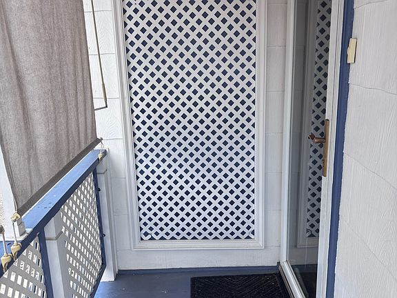 Upstairs front door (on right)