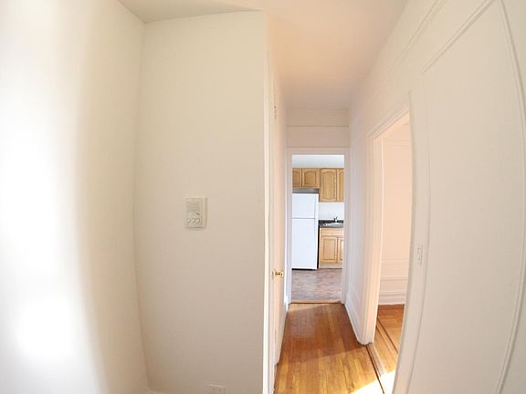 Entrance hallway with a closet ahead.