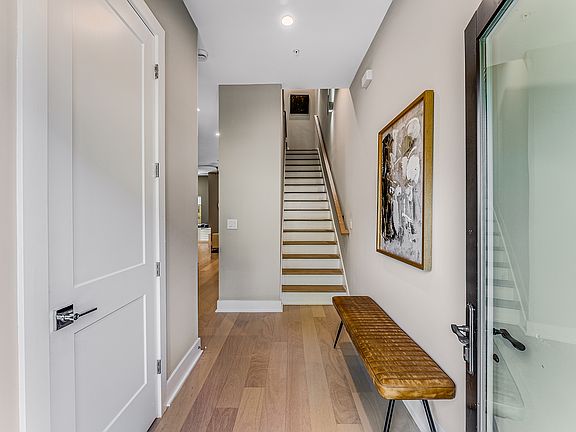 Front door entrance with powder room (rental excludes furniture and decor)