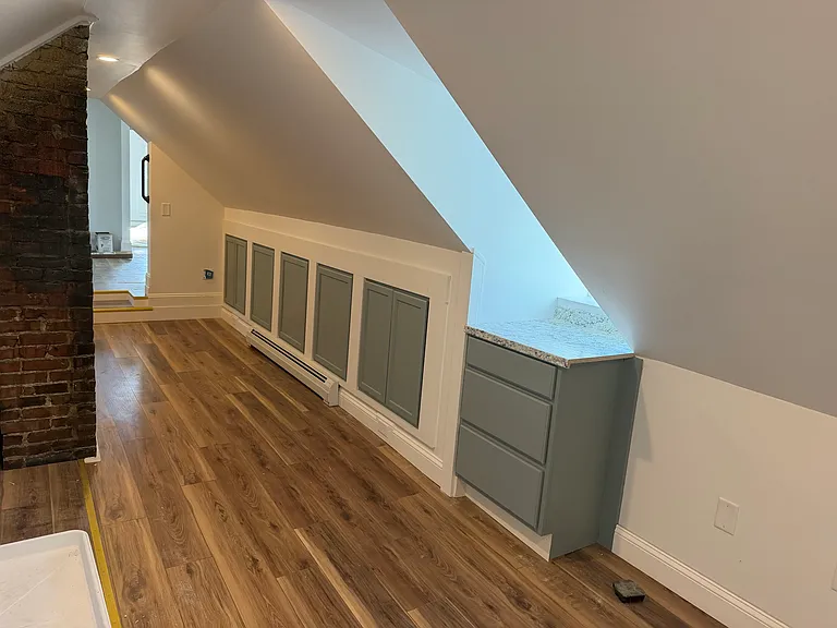 Foyer - note all the cabinets and storage on the right side. Behind you to the left is a window at the floor and to the right is another window.