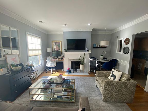 Spacious living room with a dining nook next to the kitchen