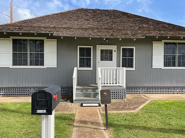 Front of the house with Historical Home Yard Sign