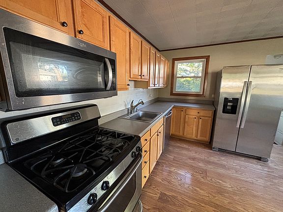 Gas stove, microwave, fridge, and dishwasher included.