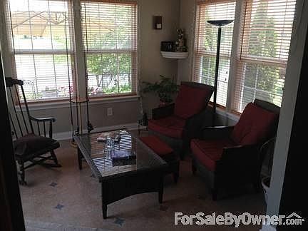 From the Kitchen
						:
						Looking thru the sunroom out to the lake