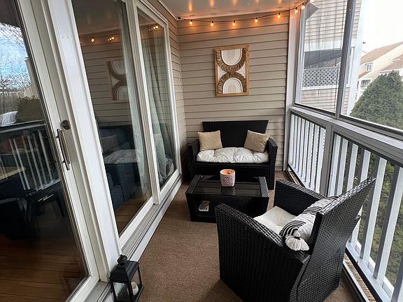 Screened in and carpeted 3 season porch with sounds of the ocean in the background