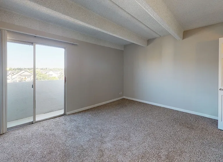 Large bedroom with balcony access