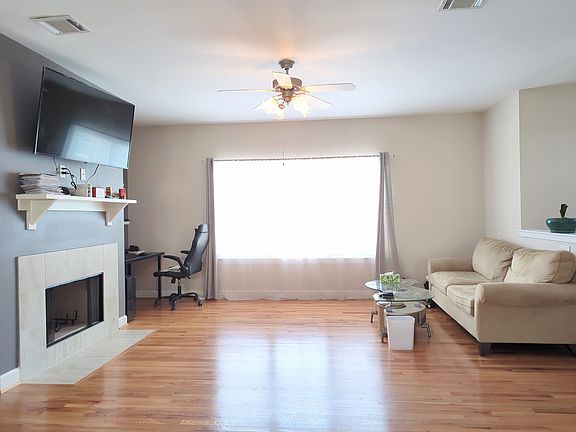 Seoncd floor living area facing the large window.