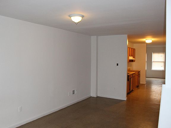Living area, kitchen, and dining area