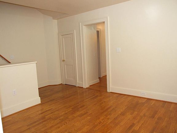 Dining room towards kitchen and stairway