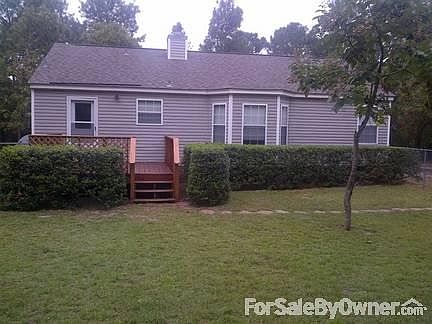 Rear view of home with 12' x 12 ' deck