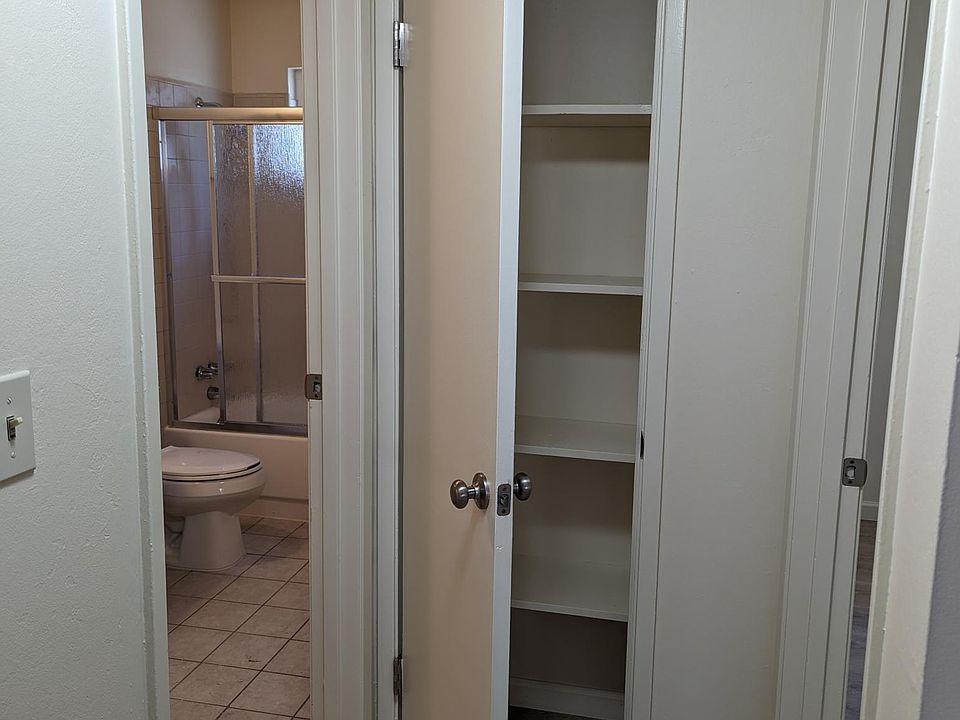 hall closet next to bathroom