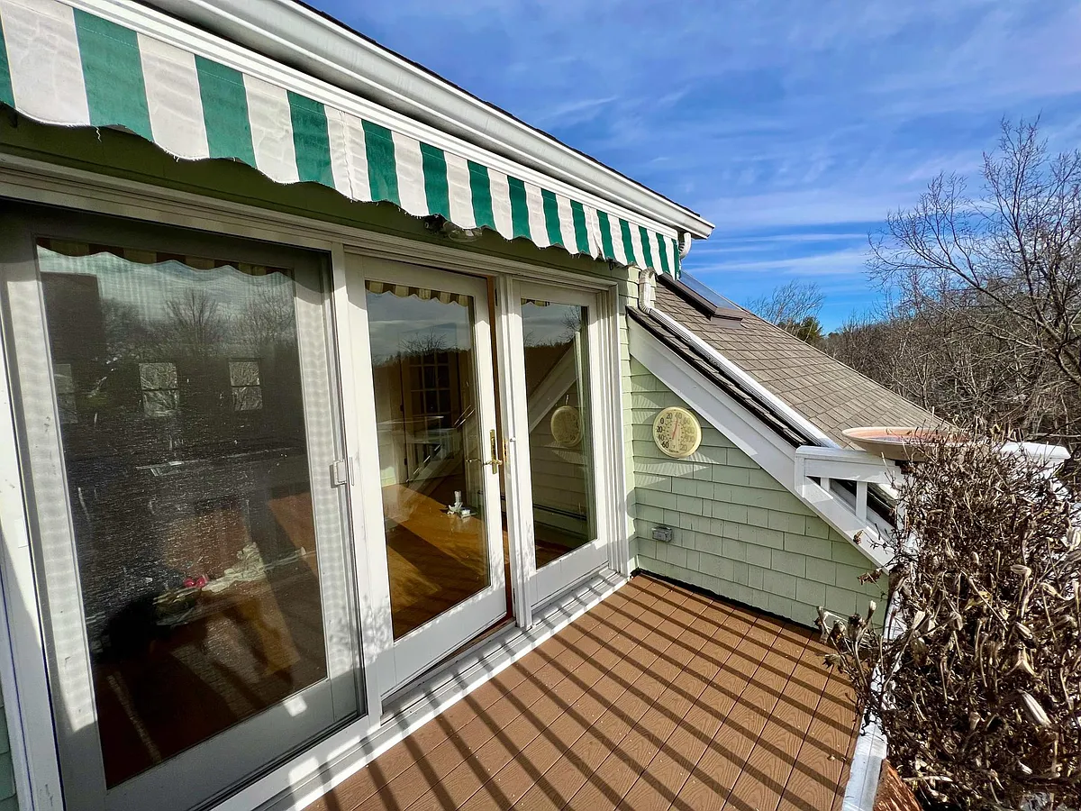 9'9" x 6' 3"' balcony faces east, morning sun. Awning pulls out for summer shade. - 140 Lincoln Rd