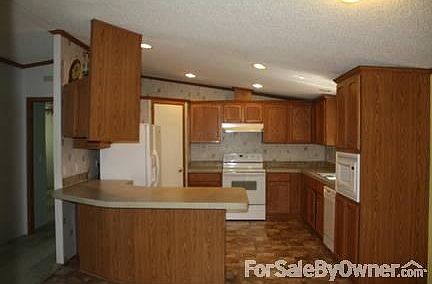 Large Kitchen-View From Dining Area
						:
						Complete with all appliances and new stainless steal sink with pull-out sprayer.