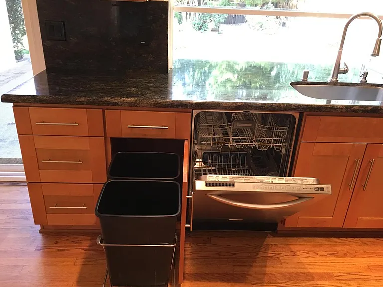 Dishwasher, and cans for garbage and recycle.